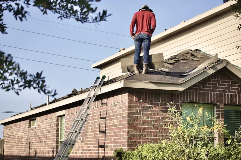 Professional roofer working on a residential roof in Westlake